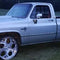 Grey 1985 chevy Silverado square body truck on 26s